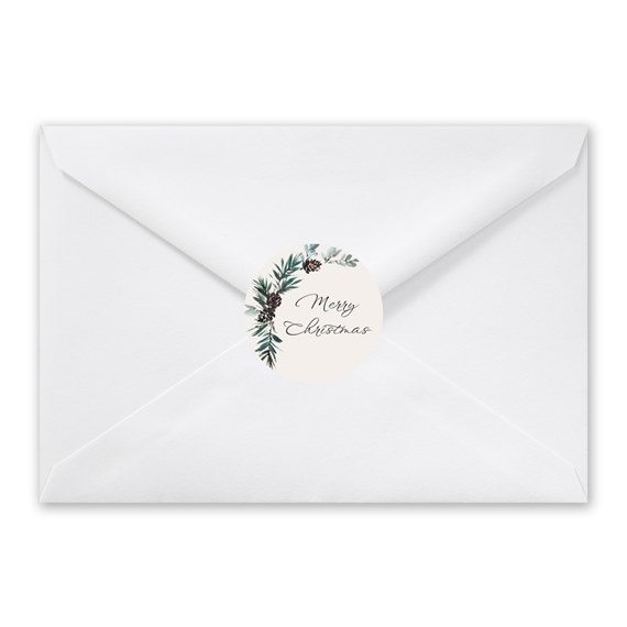 white envelope with circular seal, merry christmas text