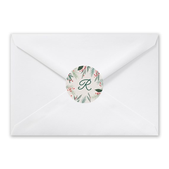 white envelope with floral seal and letter R