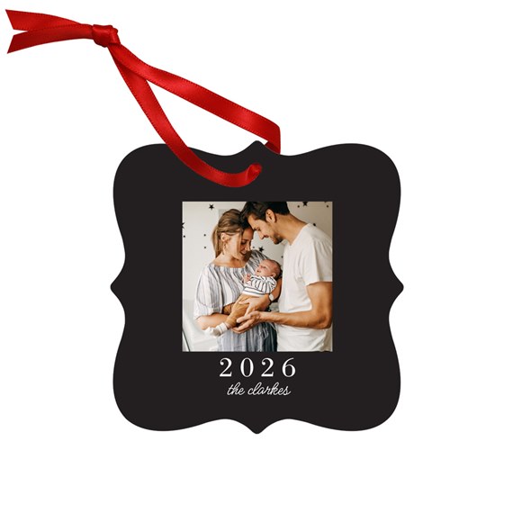black metal ornament with photo area, red ribbon