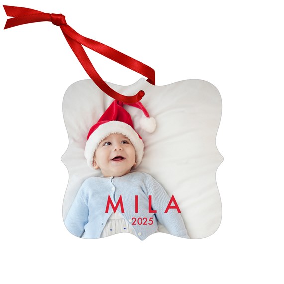 metal ornament with photo area and red ribbon