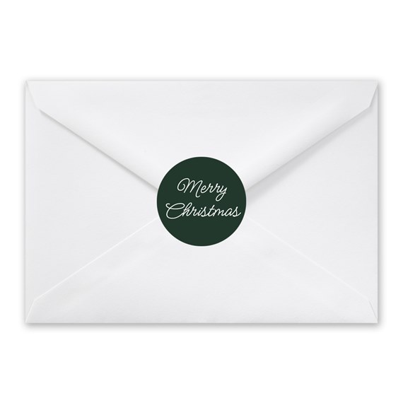 white envelope with dark green circular seal and handwritten text