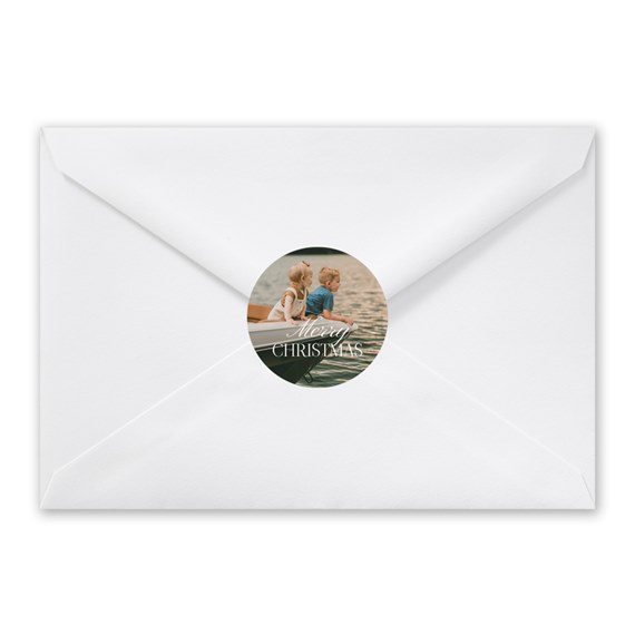 white envelope with circular photo seal and 'Merry Christmas' text