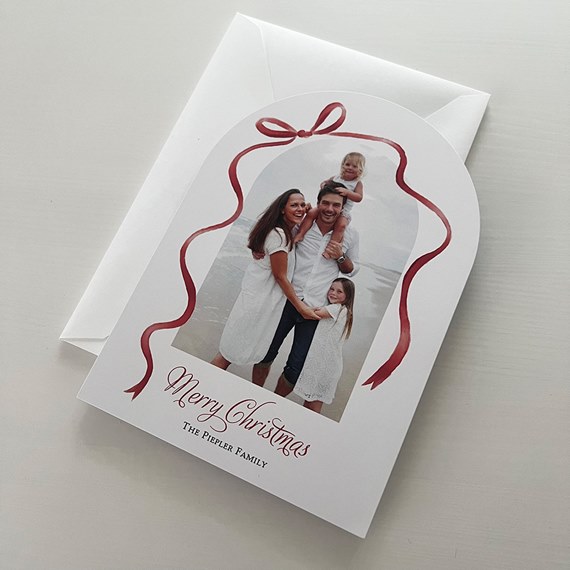 Christmas card with photo placeholder and red ribbon design