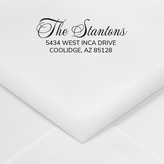 white envelope with script text name and address