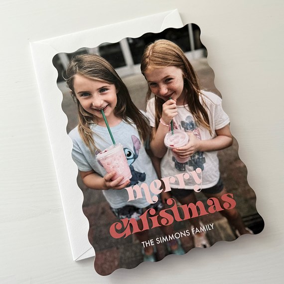Christmas card with photo placeholder, scalloped edges, and text area