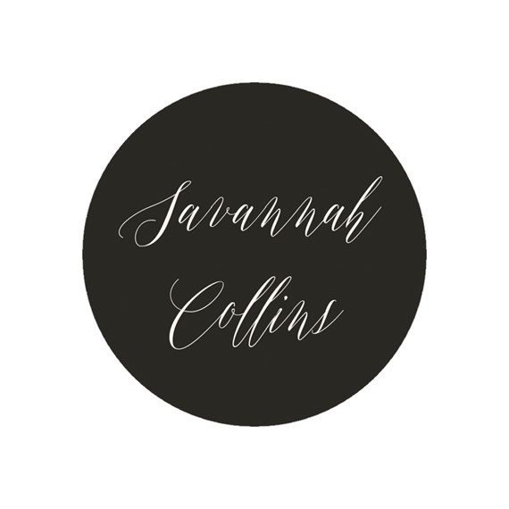 circular envelope seal with black background and white script text