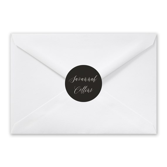 white envelope with black seal and script text