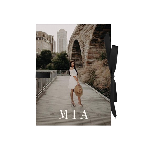 photo placeholder with name 'MIA' and black ribbon