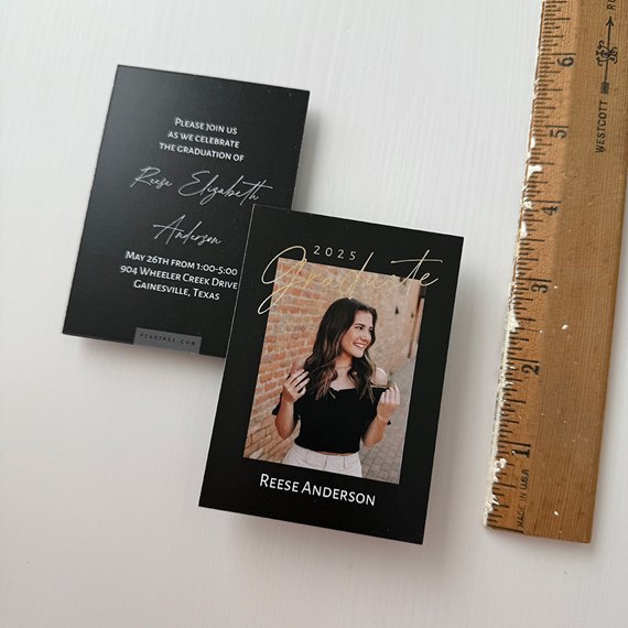black graduation invitation with photo area and gold text
