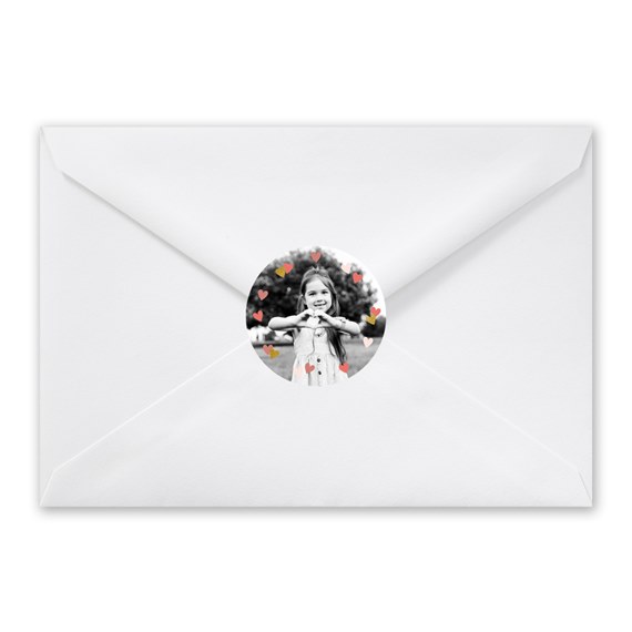 envelope with heart confetti and photo placeholder
