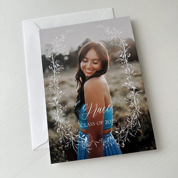 graduation announcement with floral border and photo area