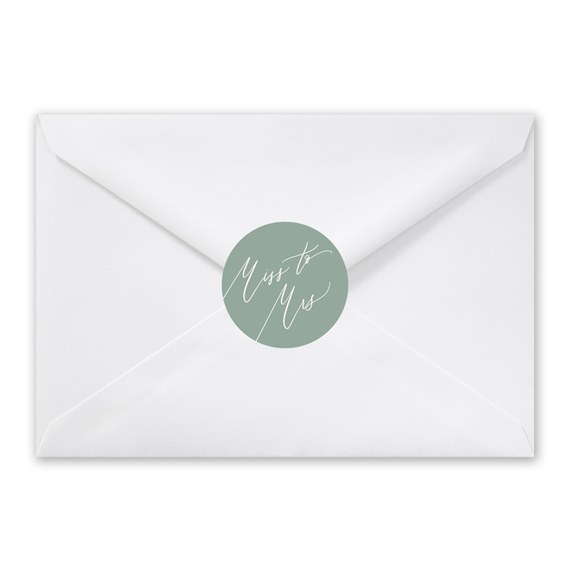 white envelope with green seal and script text