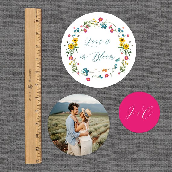 three circular stickers with floral design, photo area, and initials