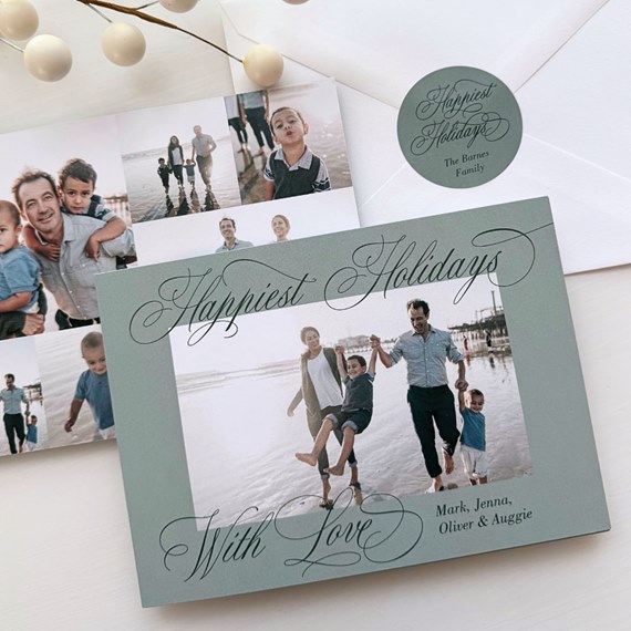 Green holiday photo card with family beach picture, script greeting 