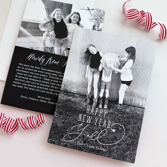 Black-and-white New Year photo card with three children and "Happy New Year Y'all" script