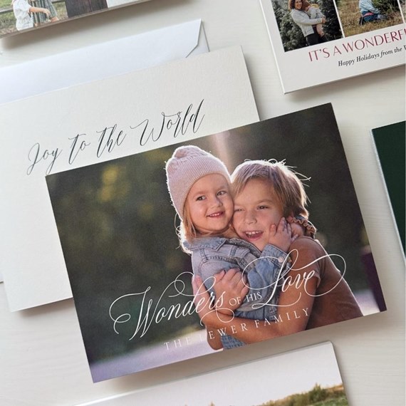 Christmas card with children photo area and decorative text