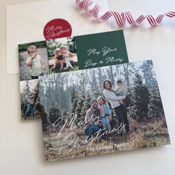 Christmas card with family photo, script text, and seal