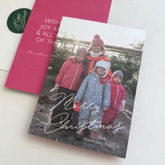 photo area with children in winter clothing, 'Merry Christmas' text