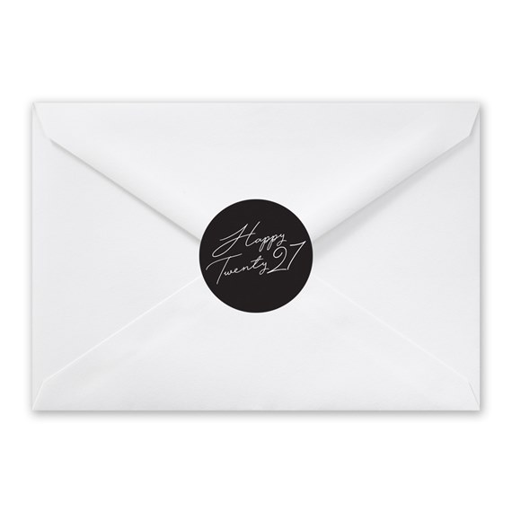 white envelope with black seal and scripted text