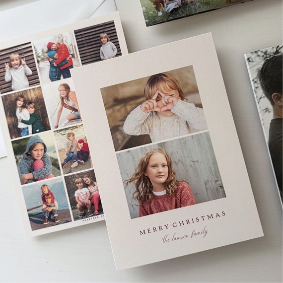 Holiday photo card with two portrait photos of children on cream background and 