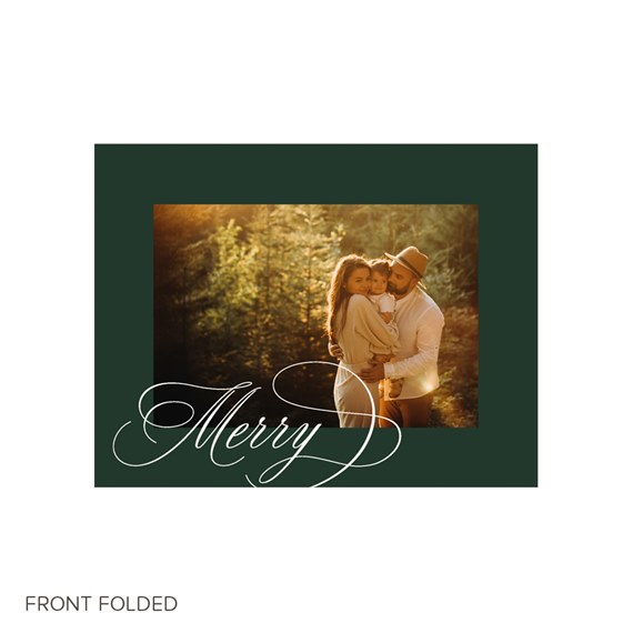 Folded holiday photo card with dark green border, family portrait in golden woodland light and white calligraphy reading Merry.