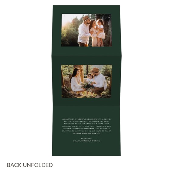 Folded holiday photo greeting card with two family photos on a dark green background and white printed message text.