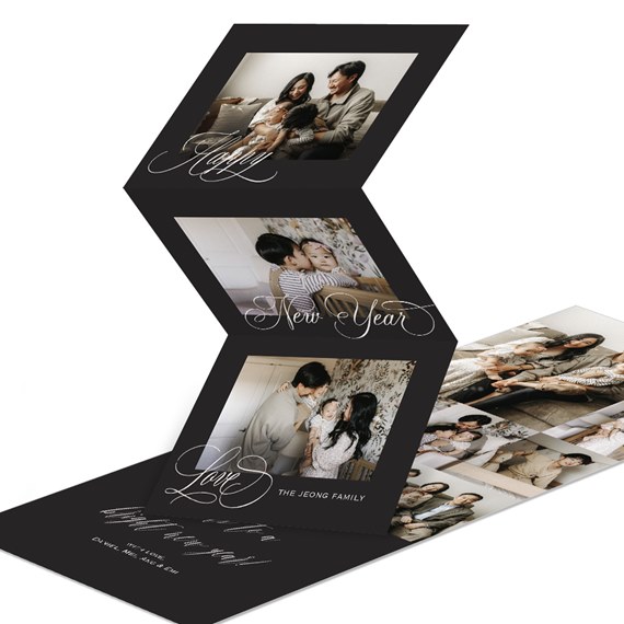 Black accordion New Year photo card with three family photos and white calligraphy script