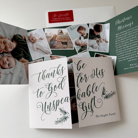 Christmas card with decorative text and pine illustrations