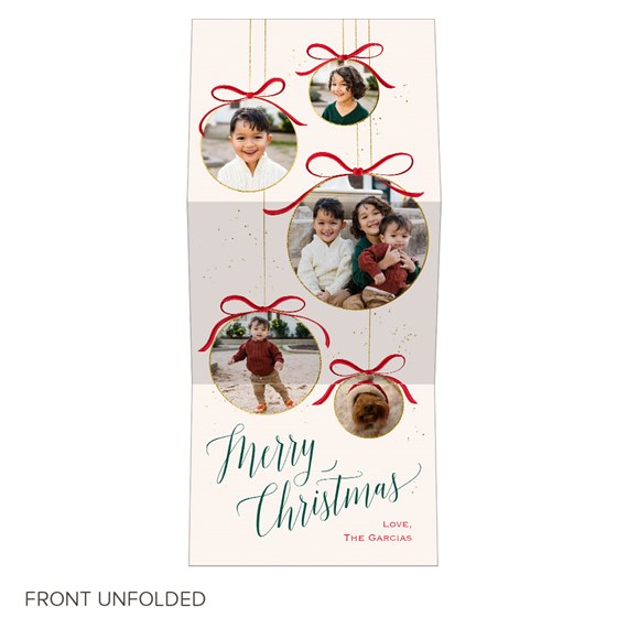 Christmas photo card with hanging ornament frames, red bows, gold trim and green script