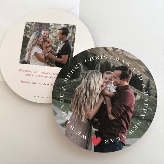 two round holiday cards with photo area and festive text