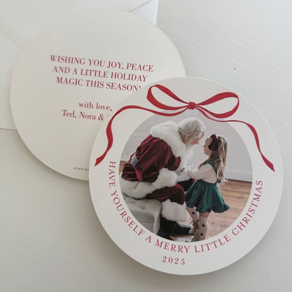 round christmas card with photo placeholder and red bow design