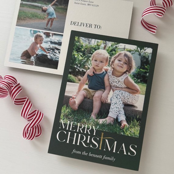 Christmas photo postcard with two children, dark green border, "Merry Christmas" text and gold accent
