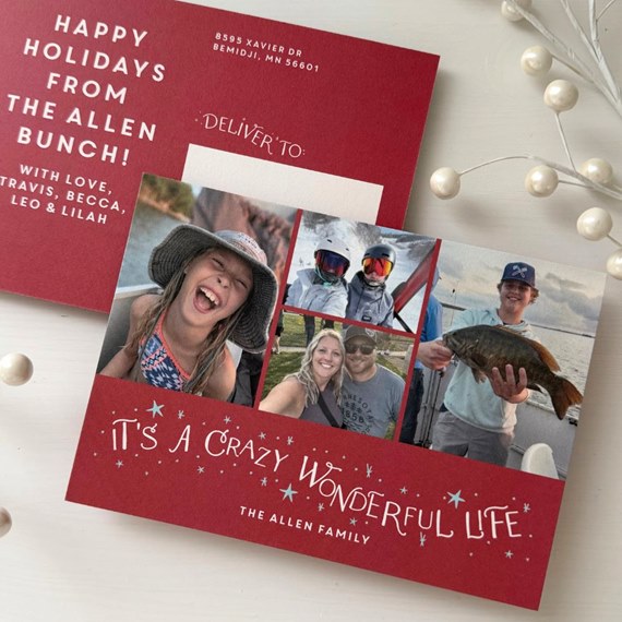 Red holiday postcard with four-photo collage, white hand-lettered greeting and blank address area