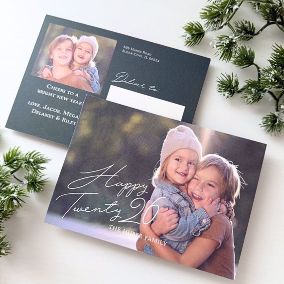New Year postcard with family photo, hand-lettered greeting on front and address panel on back