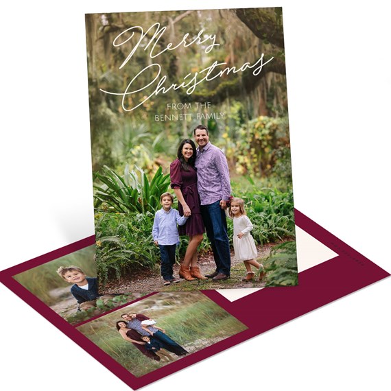 Folded holiday photo card with family portrait, white scripted 