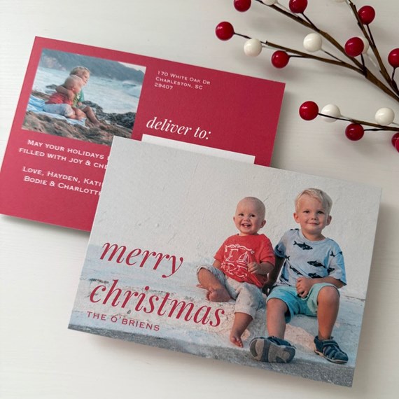 holiday photo postcards with two children on a beach and a red address back