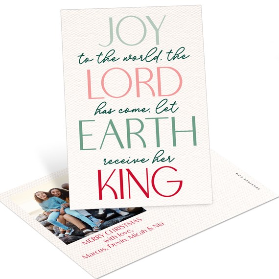 Christmas postcard with large typographic scripture text and a small family photo on textured cream-white cardstock
