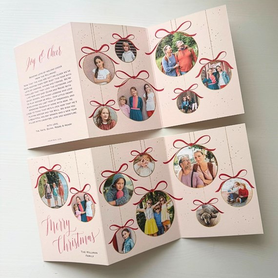 folded Christmas card with photo placeholders and decorative bows