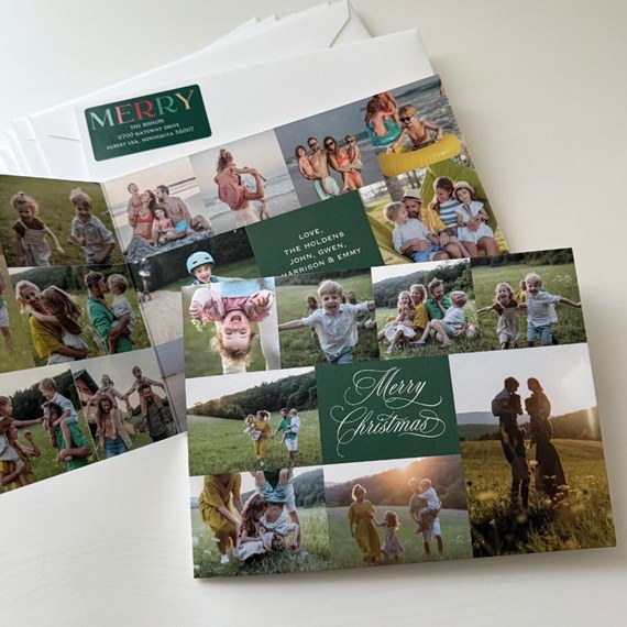 collage-style Christmas photo card with family pictures and a dark green central panel reading Merry Christmas, displayed with white envelopes