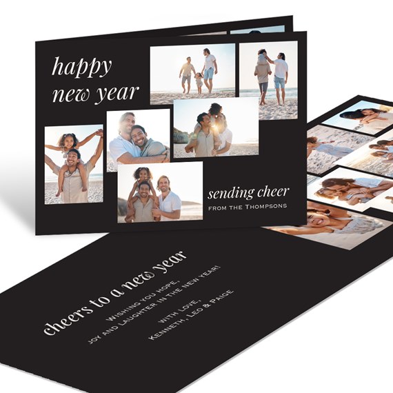 Folded New Year greeting card with black background, white script text and a collage of beach family photos