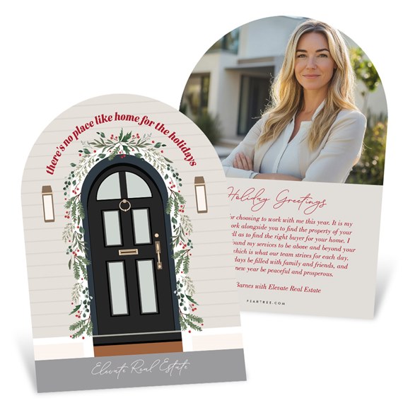 arched holiday business card with illustrated black front door and wreath, and a back showing a female real estate agent photo and holiday greeting