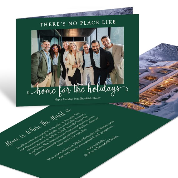 business holiday greeting card with dark green border, group photo, and white script 