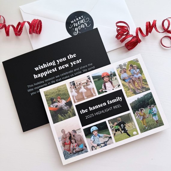 new year photo collage greeting card with grid of family photos, central dark caption bar, black greeting insert and white envelope