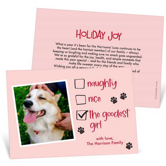 Pink holiday card with dog photo and checklist 'naughty, nice, the goodest girl' with paw prints