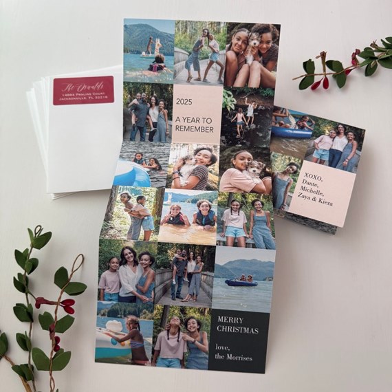 Fold-out A5 Christmas photo card with grid collage of family photos and pink and black text panels, shown with envelopes