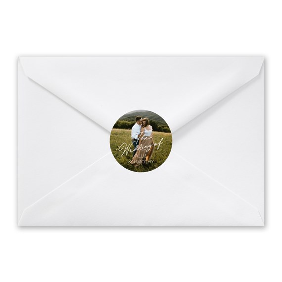white envelope with photo placeholder and round seal