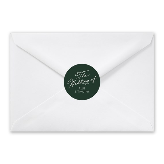 white envelope with dark green seal and white script text