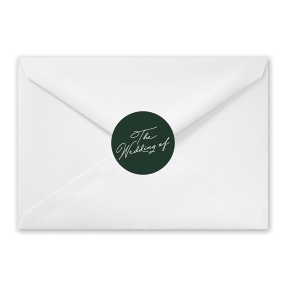 white envelope with green seal and script text