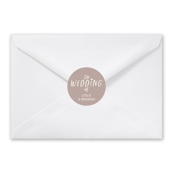 white envelope with round seal for wedding invitation