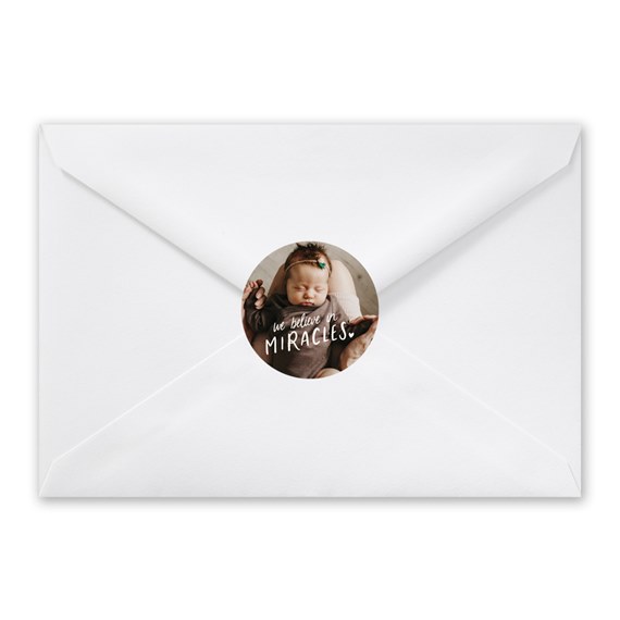envelope with round sticker and text